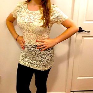 White see-through shirt with flower print.